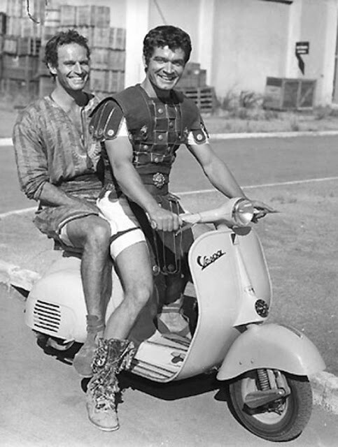 Charlton Heston Riding a Scooter During Filming of Ben Hur 1959